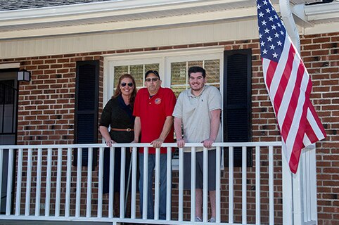 Levine family in front of new home