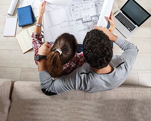 Couple reviewing home schematics
