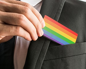 Rainbow card in suit jacket pocket
