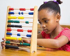 preschooler with abacus