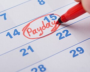 calendar with "payday" written and circled