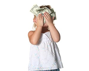 Child with dollars pressed on her face
