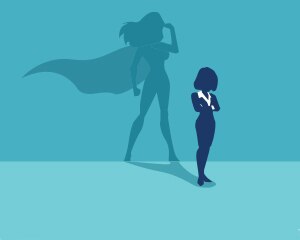 Woman shadow in superhero cape 