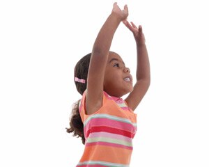 Little girl reaches up high with her arms