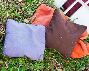 Photo of bean bags sitting in the grass