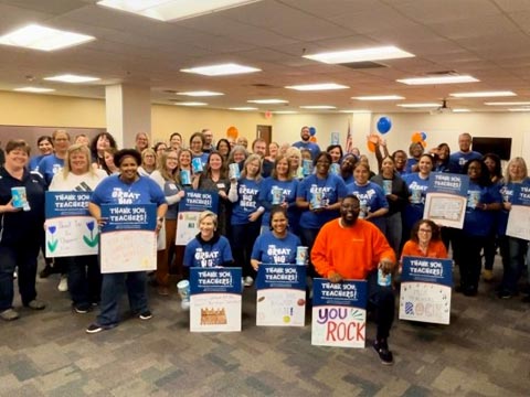 Group of PNC employees show appreciation to pre-K teachers with encouraging posters