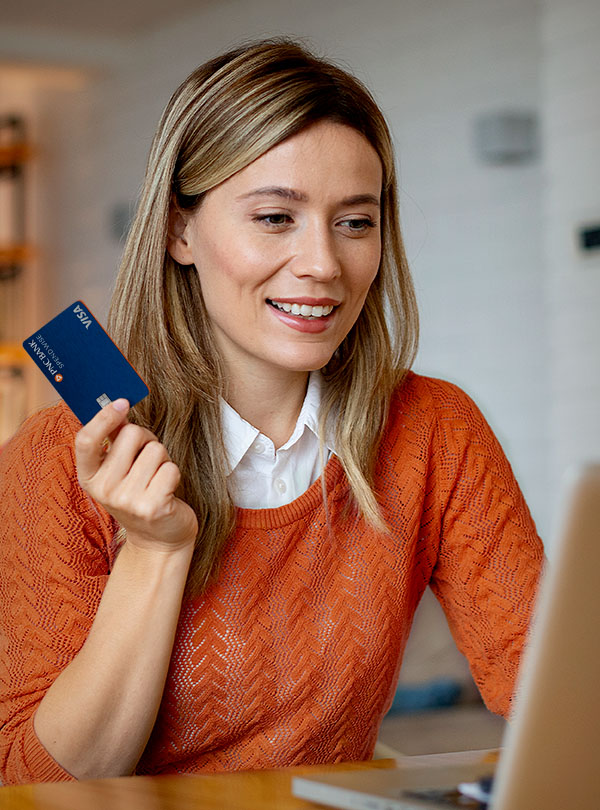 Woman shopping online with a PNC Spend Wise Credit Card