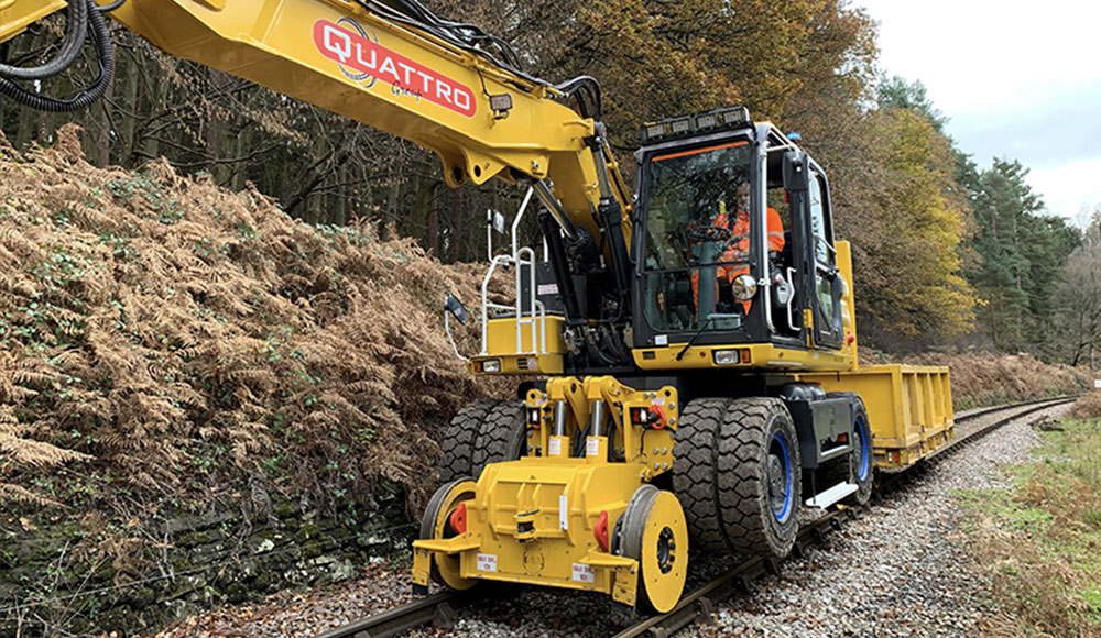 Quattro employee using rail equipment