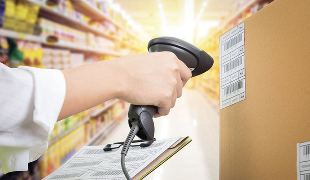 Retail & Asset Solutions employee scanning merchandise for inventory count