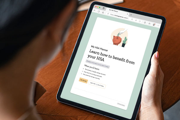 Lady holding a tablet, looking at PNC My HSA planner