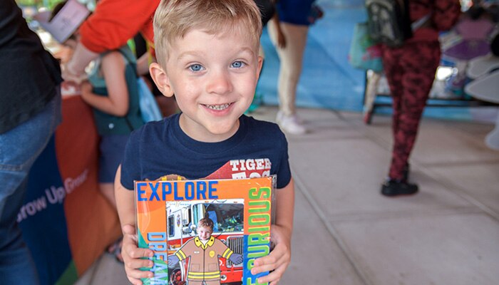 Child enjoying educational activities at a PNC Grow Up Great Mobile Learning Adventure event.