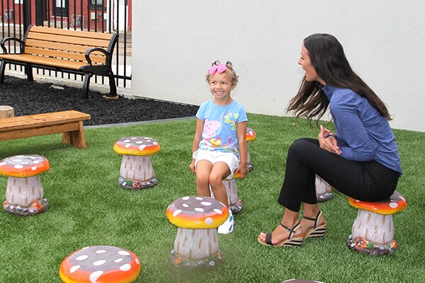 Nature based play and learning space in Allentown featuring mushroom seats for children.