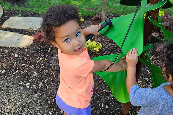 Nature based play and learning space in Kansas City with children.